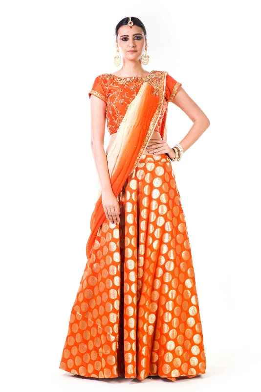 Deep Discounts Orange Brocade Lehenga With A Chiffon Dupatta And Hand Embroidered Silk Blouse Deep Discounts Orange Brocade Lehenga With A Chiffon Dupatta And Hand Embroidered Silk Blouse